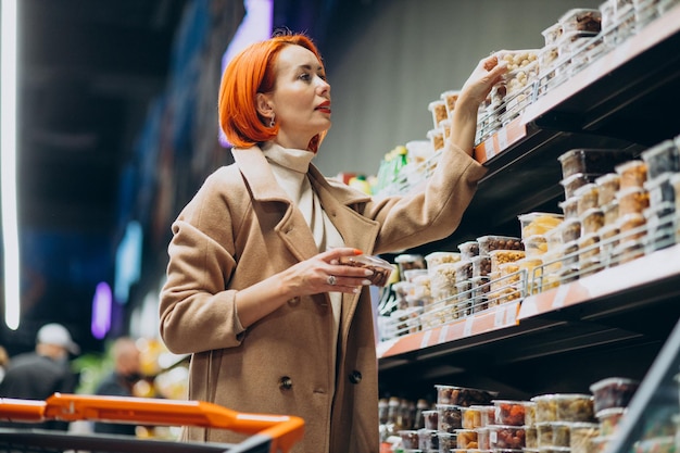 Free Photo woman choosing products at super market