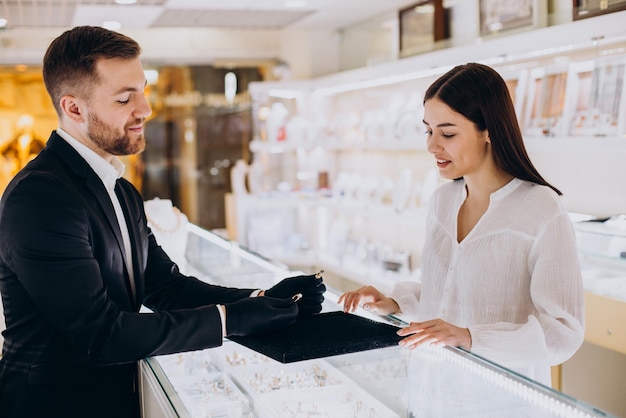 Free Photo woman choosing a ring at jewelry shop