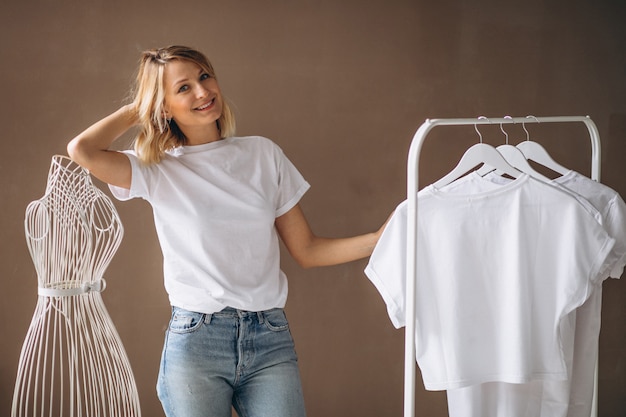 Free Photo woman chosing a white shirt