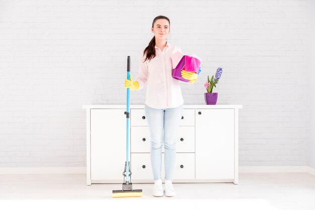 Woman cleaning her home