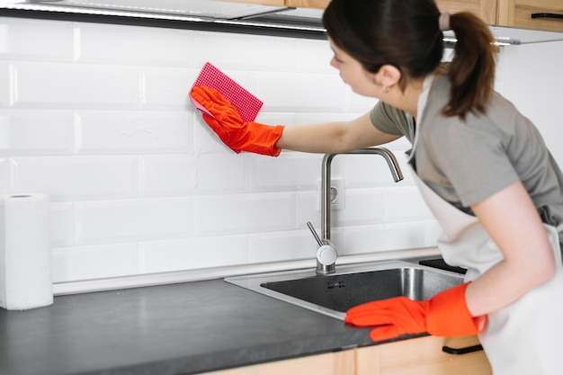 Woman cleaning with rag