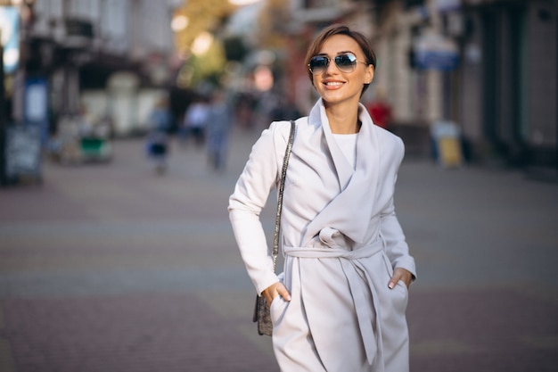 Free photo woman in coat outside th street