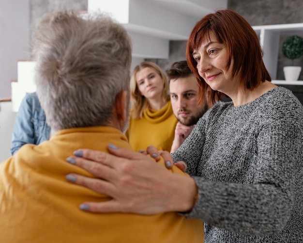 Free photo woman comforting man at therapy