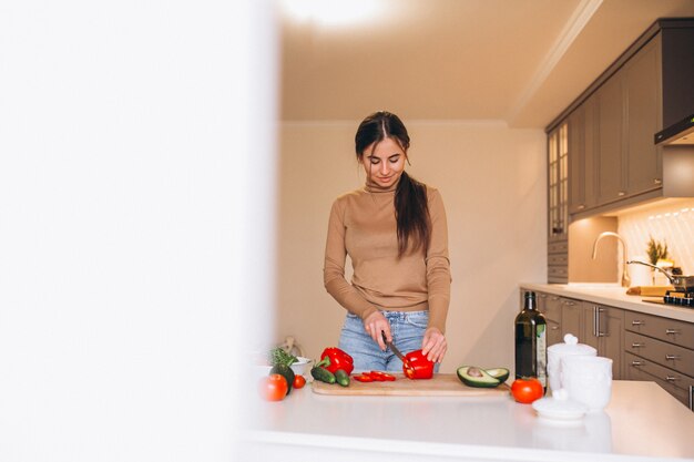 Woman cooking at kitchen