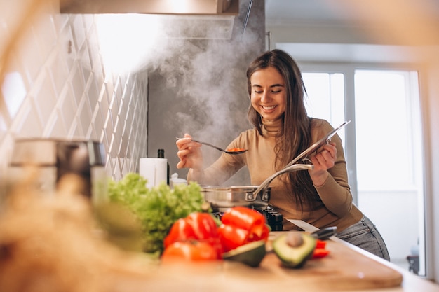 Woman cooking at kitchen