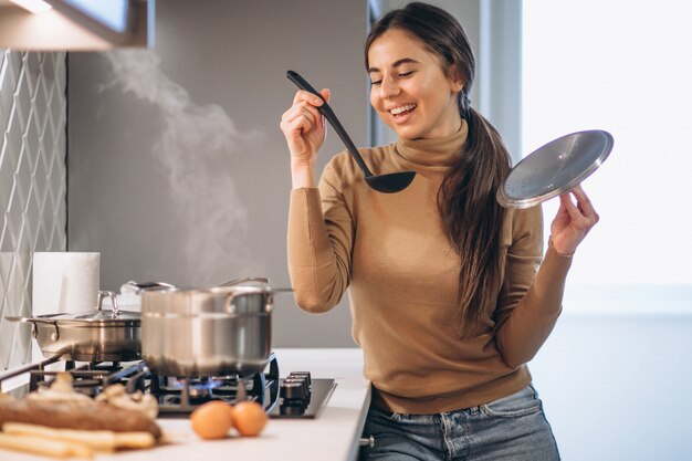 Woman cooking at kitchen