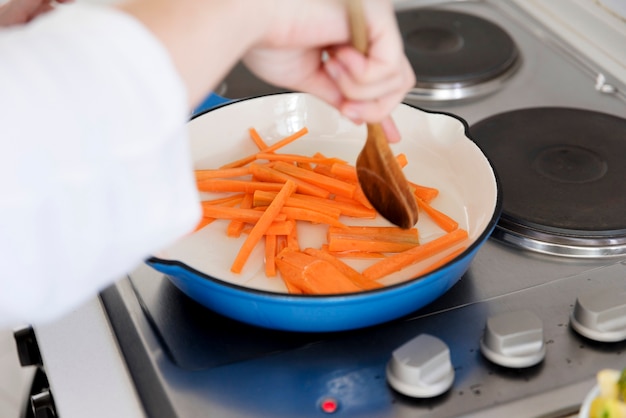 Woman cooking in kitchen