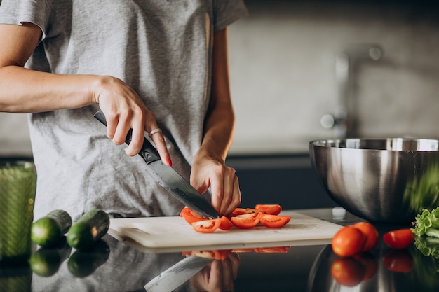 Free photo woman cooking lunch at home