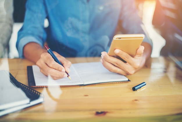 Woman copying something from his mobile