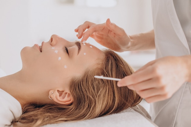 Woman at cosmetologist having beauty treatment