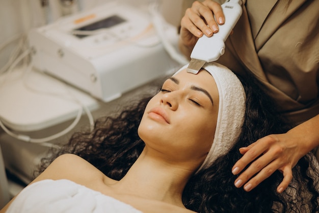 Woman at cosmetologist making beauty procedures