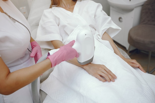 Woman in cosmetology studio on laser hair removal