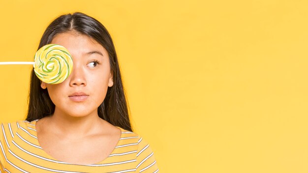 Woman covering her eye and looking away