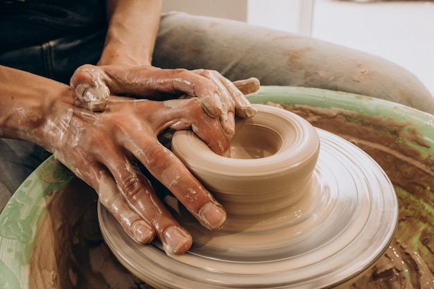 Woman craftmaster at a pottery shop