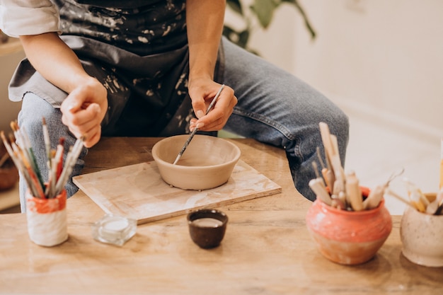 Woman craftmaster at a pottery shop