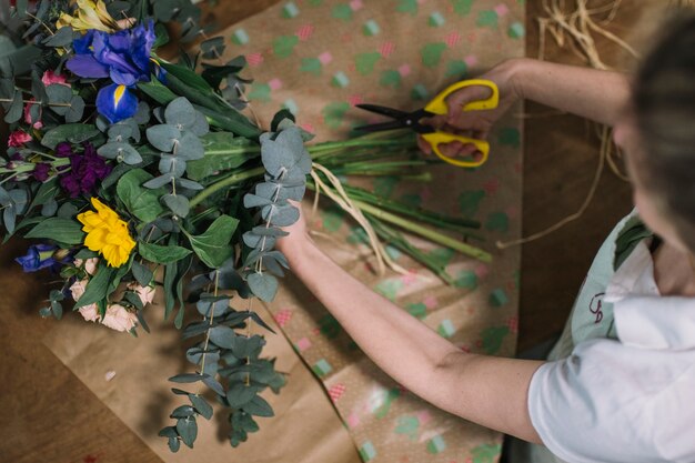 Woman creating floral composition