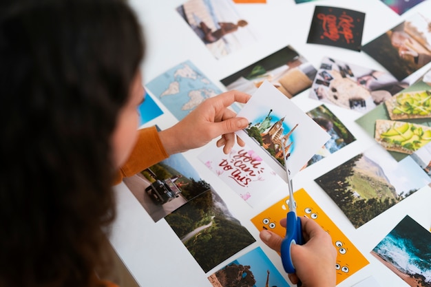 Free Photo woman creating inspiring vision board high angle