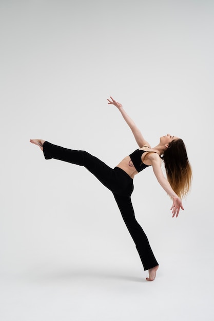 Woman dancing in studio full shot