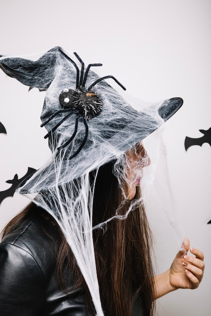 Free photo woman in decorated halloween hat