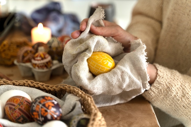 Woman decorating easter eggs