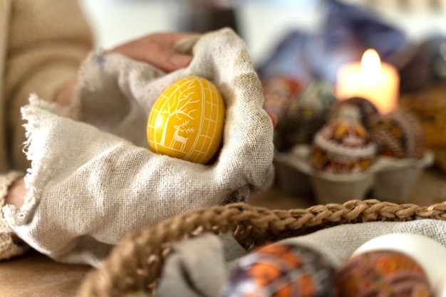 Free photo woman decorating easter eggs