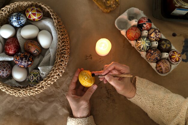 Woman decorating easter eggs