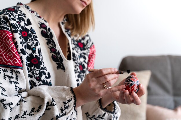 Woman decorating easter eggs