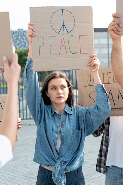 Woman demonstrating together with people