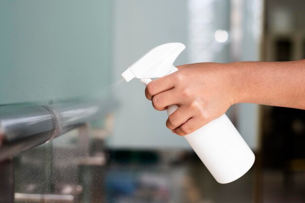 Woman disinfecting the railings during coronavirus outbreak