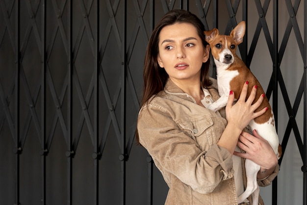 Free photo woman and dog posing