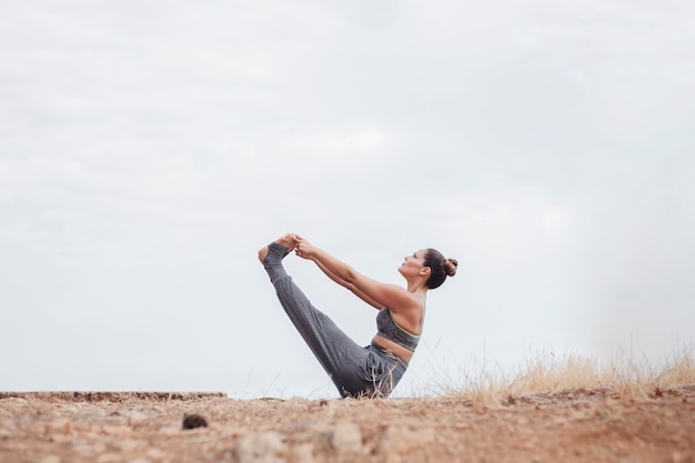 Woman doing exercise outdoors