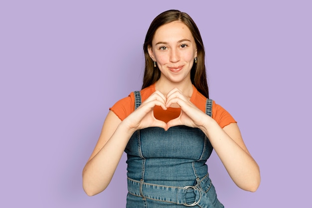 Woman doing heart hands gesture