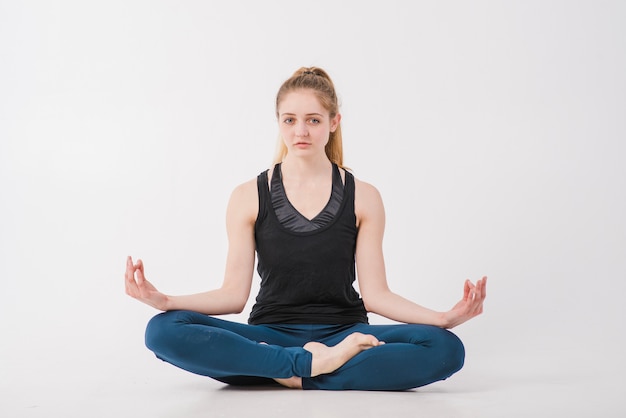 Free photo woman doing home meditation on floor