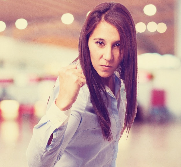 Free photo woman doing a power gesture