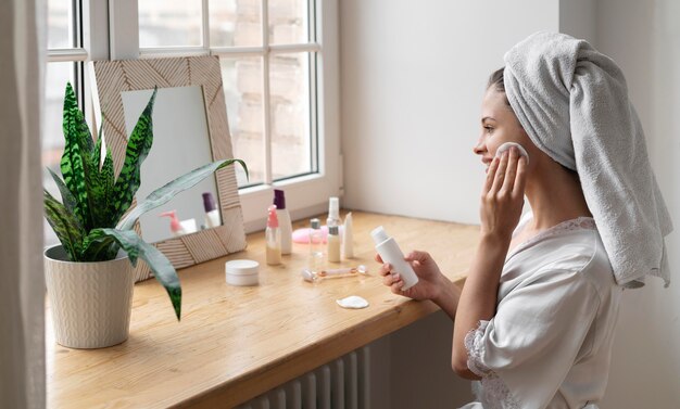 Woman doing a self care treatment indoors