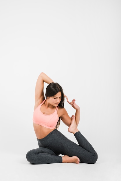 Free Photo woman doing yoga exercise