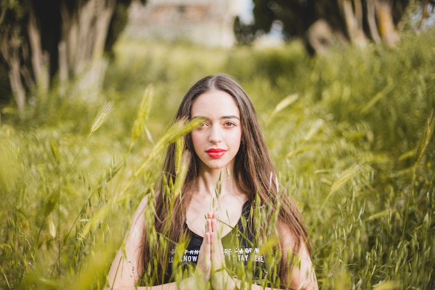 Woman doing yoga in field