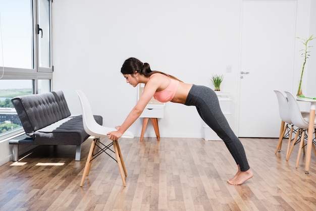 Woman doing yoga at home