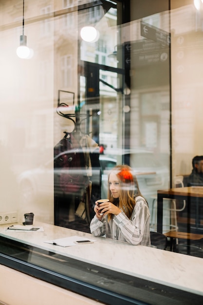 Free photo woman drinking coffee