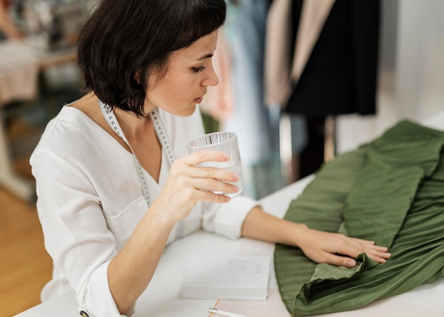 Woman drinking water on break