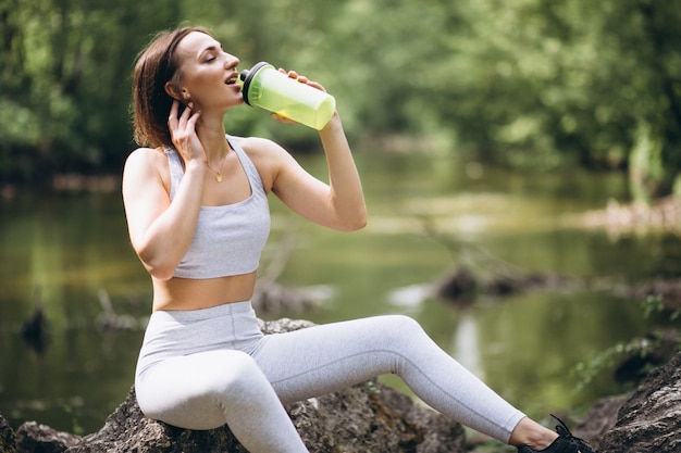 Woman drinking water in sportswear