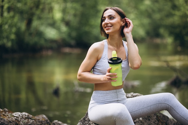 Woman drinking water in sportswear