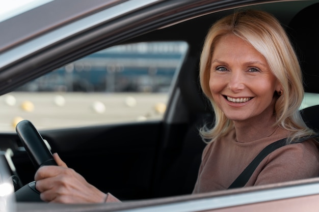 Free photo woman driving car for test to get driver's license