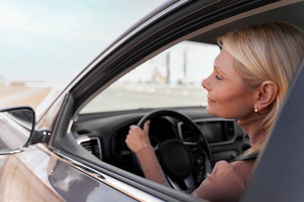 Free photo woman driving car for test to get driver's license