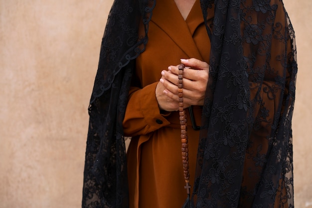 Free photo woman during religious pilgrimage at the church