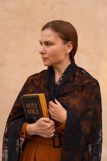 Free photo woman during religious pilgrimage at the church