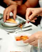 Free photo woman eating honey and toast for breakfast