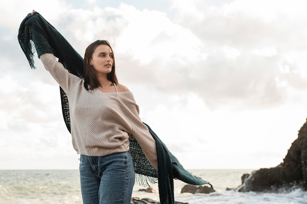 Free Photo woman enjoying a beach trip with copy space