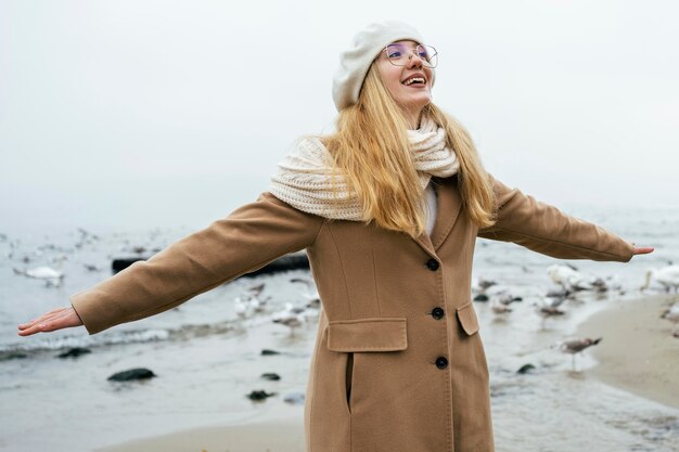 Woman enjoying the beach in winter