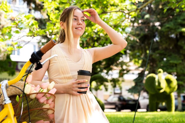 Woman enjoying coffee on a morning ride